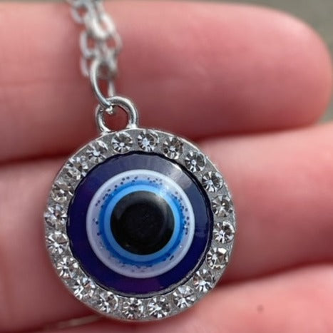 Round Evil Eye Necklace surrounded by sparkle